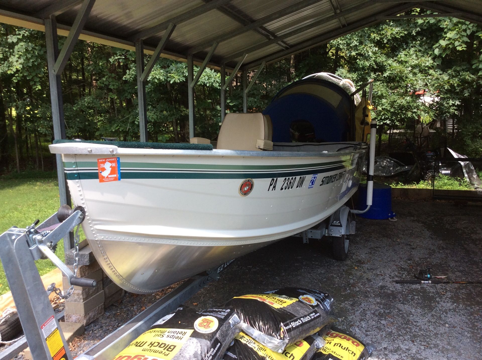 16 foot smoker craft with 9 .9 Mercury engine new trailer live bait