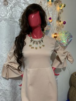 Blush beige size small stretch dress with unique bow detail in arms