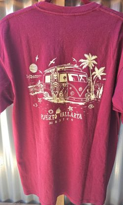 Maroon short-sleeve t-shirt with a graphic of a vintage VW surf bus and the text "Puerto Vallarta Mexico 
Excellent condition 
No rips or stains 
Like