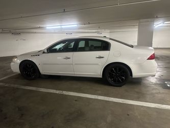 Buick Lucerne White Sedan with Black Wheels