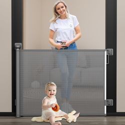 Retractable dog/baby gate