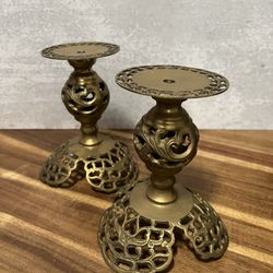 pair of ornate, vintage-style brass candle holders