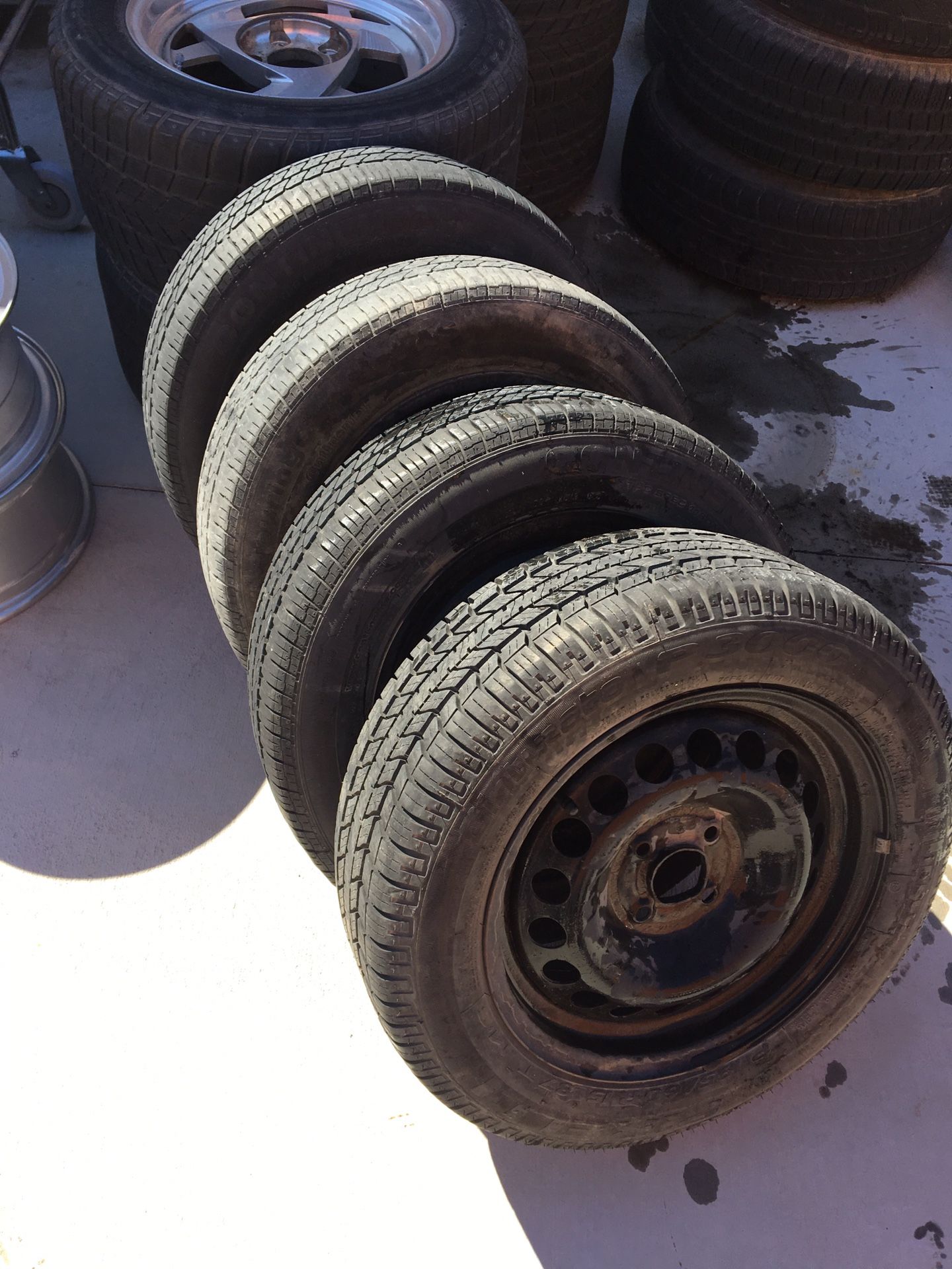 Used Chevy Cobalt wheels 1 new tire 3 worn rollers set of 4