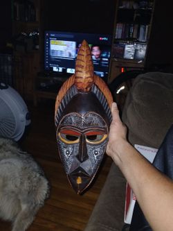 Handcrafted african wooden wall mask.