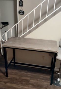 Table with two stools same color as the table