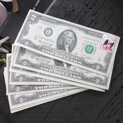 2 Dollar Bills With April 13th 1976 Stamp On Them