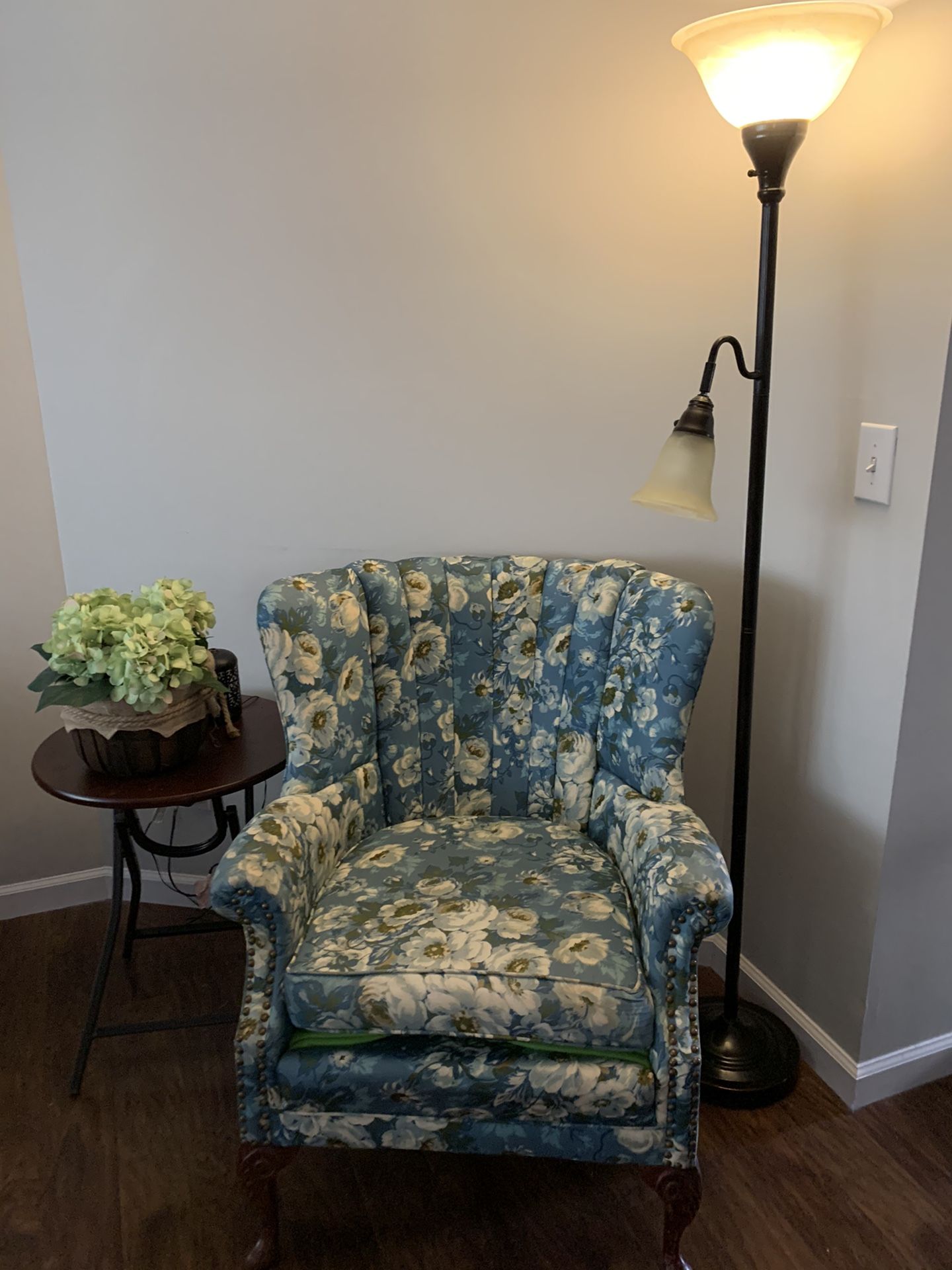 Antique floral sitting chair. Bought from antique shop. The sitting cushion has a tear from wear on one side but does not show. I bought it like that.