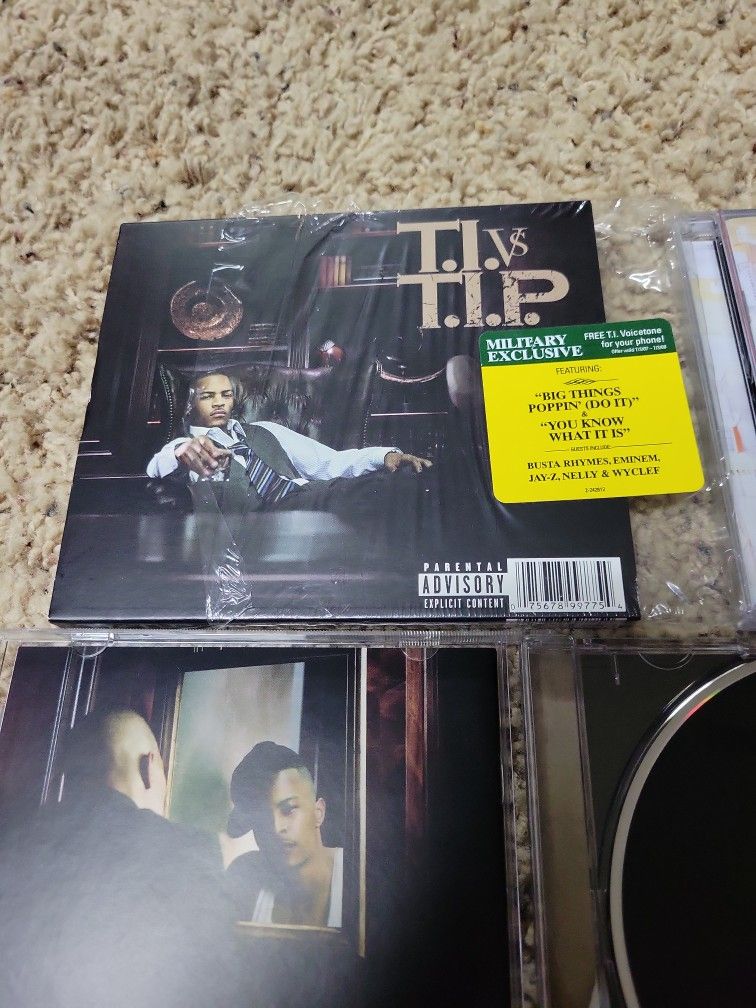 T.I. vs T.I.P. CD Autographed