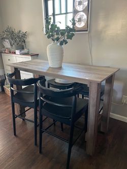 Bar stool dining table with 4 wood chairs