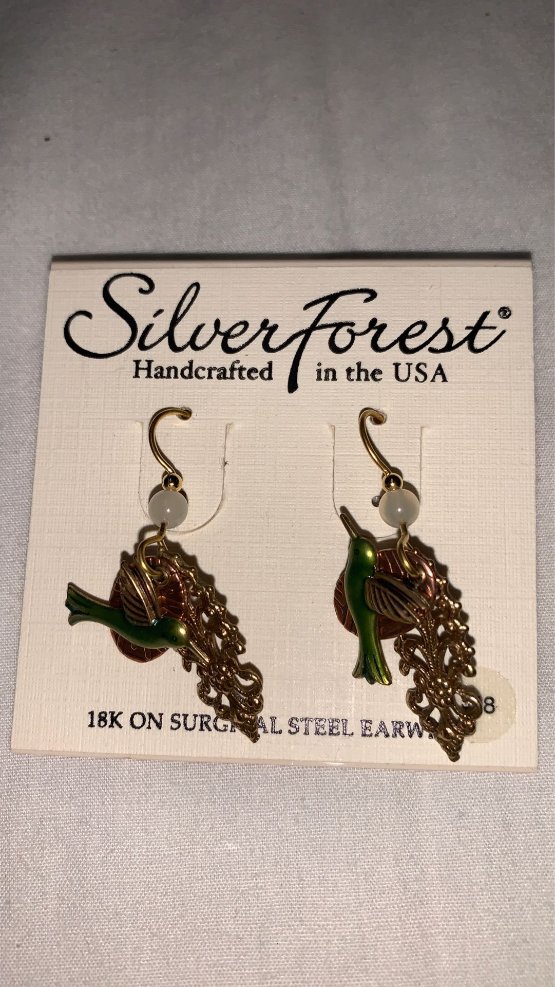 Brand new earring silver forest paid 18 and I will take 12
