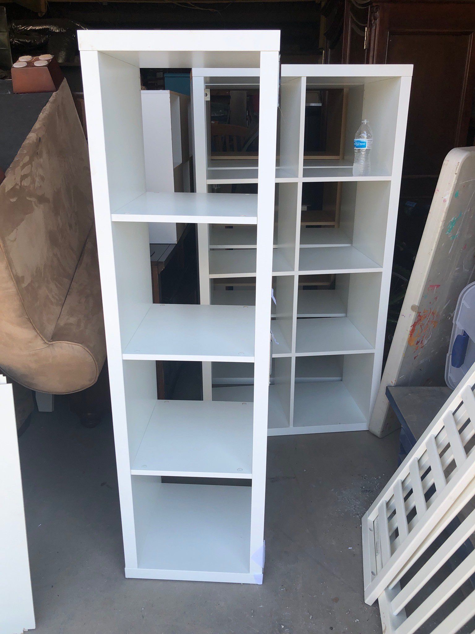 Tall white and tan storage shelves
