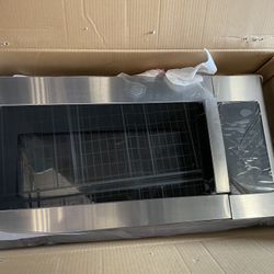 Brand new GE 1.9 cu. ft. Over-the-Range Microwave in Stainless Steel with Sensor Cooking