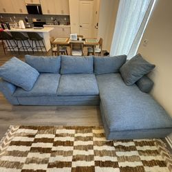 Living Spaces 	SHUFFLE SOFA WITH REVERSIBLE CHAISE