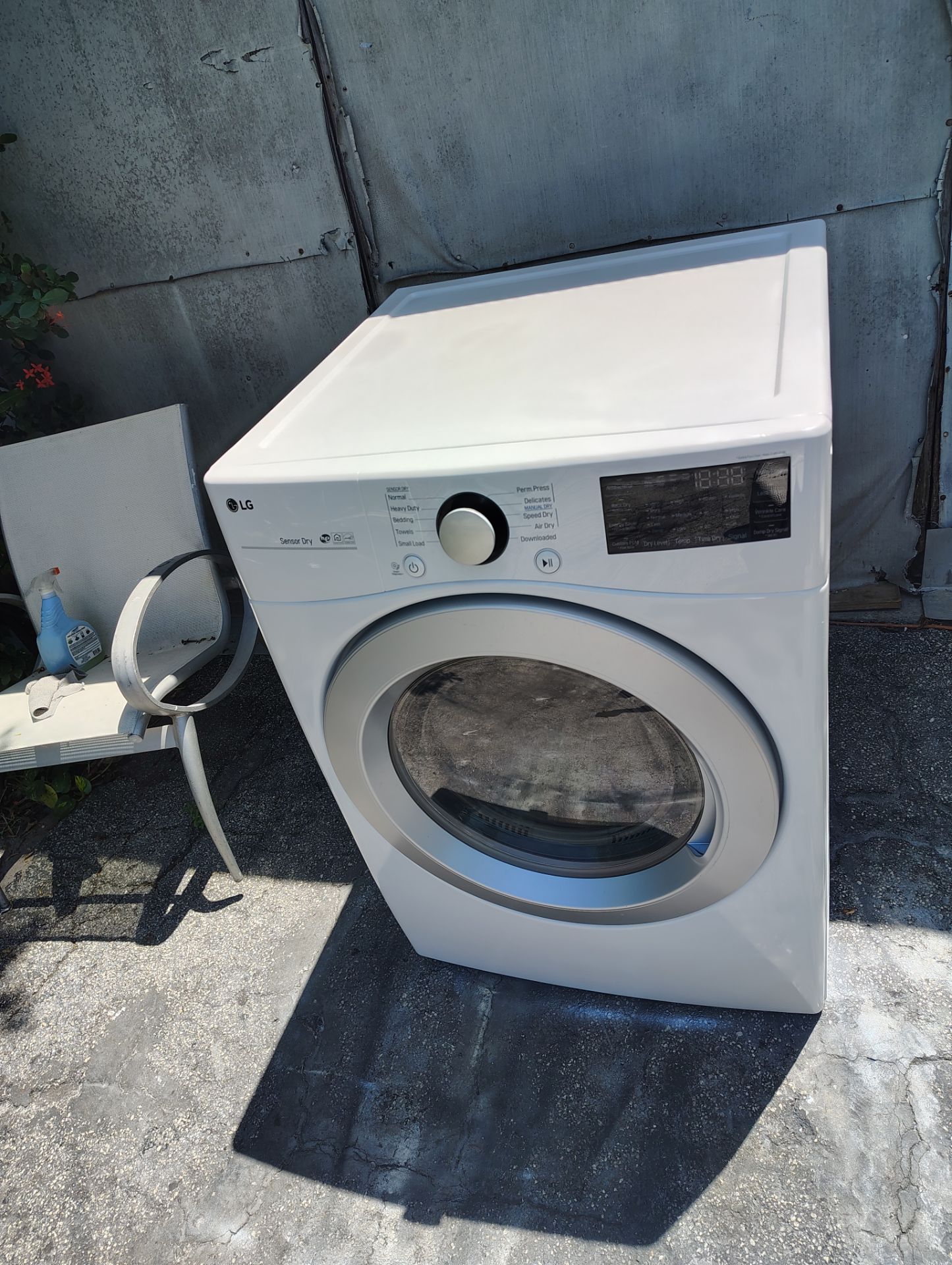 LG dryer machine glass front door white color