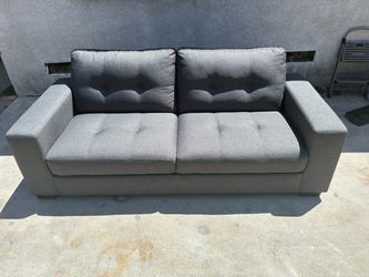 Delivery Available / Grey medium sized living spaces couch