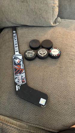 Ontario Reign hockey pucks and decorative hockey stick
