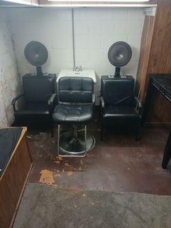 2 hair dryers 1 sink and a extra  chair