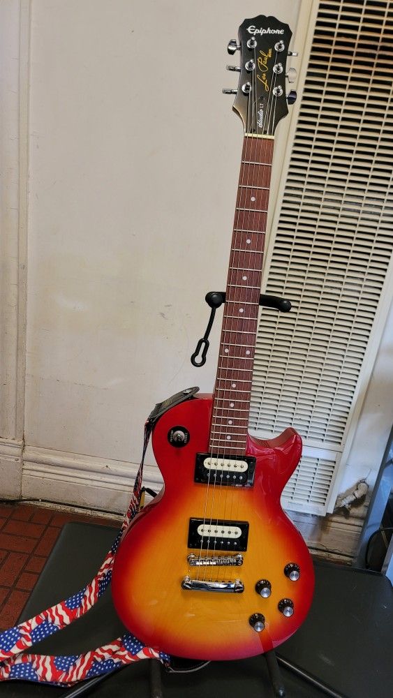 EPIPHONE LES PAUL STUDIO LT ELECTRIC GUITAR MODEL STUDIO LT E1 MADE IN KOREA IN CHERRY BURST COLOR.