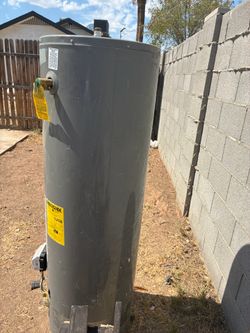 Gas water heater for sale , must be picked up .  I need an electric water heater . Trade  for electric or for sale.