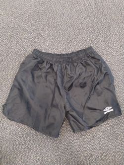 Vintage men UMBRO shorts XL

Black. Great shape. Normal wear. Soccer shorts
15" length from waist. 4" from crotch area