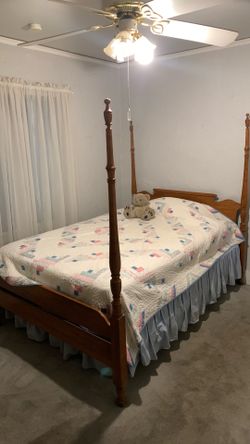 Full size poster bed.