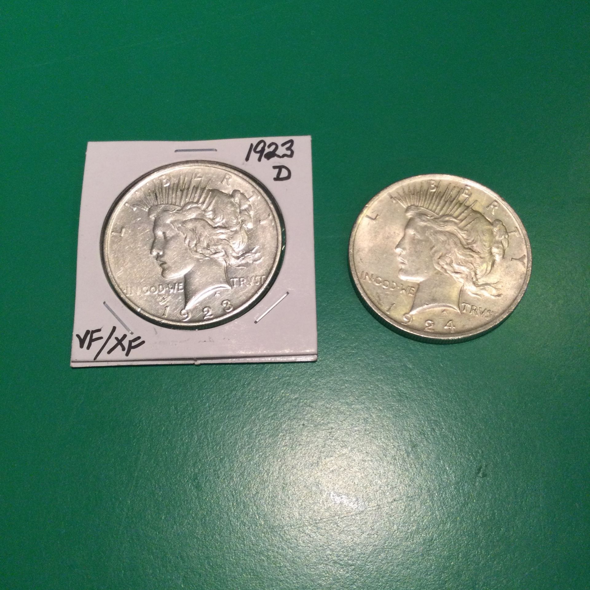TWO VERY NICE PEACE DOLLARS.