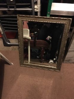 Antique mirror around 21/2 x2 gold frame