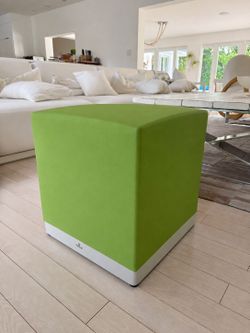 Original MONDECASA designer ottoman in a vibrant lime green  with an aluminum base