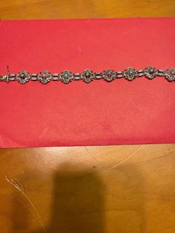 925 silver bracelet also go play. It has emeralds rubies sapphires very elegant asking $180 for it.