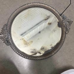 vintage mirrored tray with a silver-plated rim.