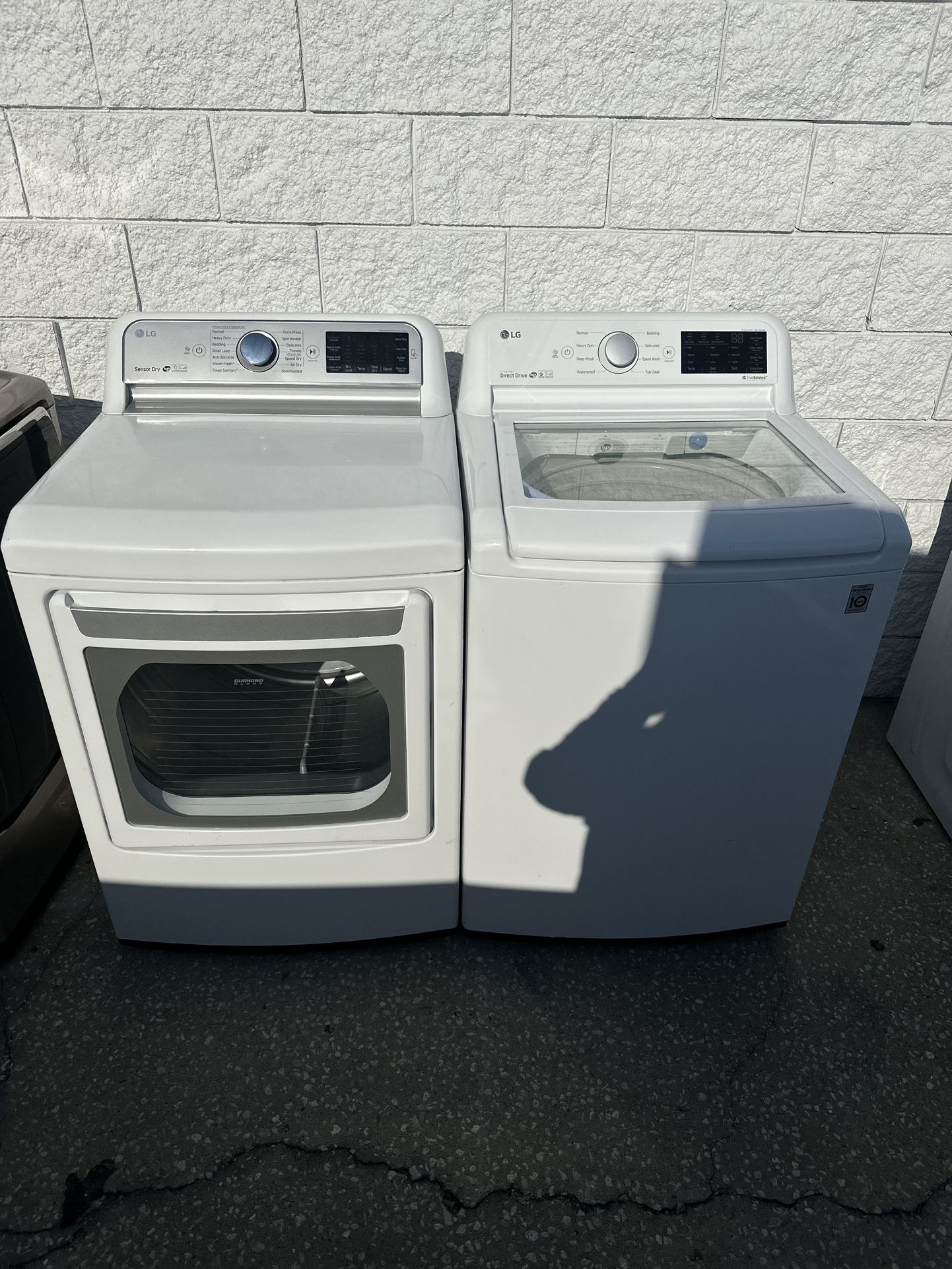 LG top-loading washer and dryer set with two months warranty, delivery and installation available