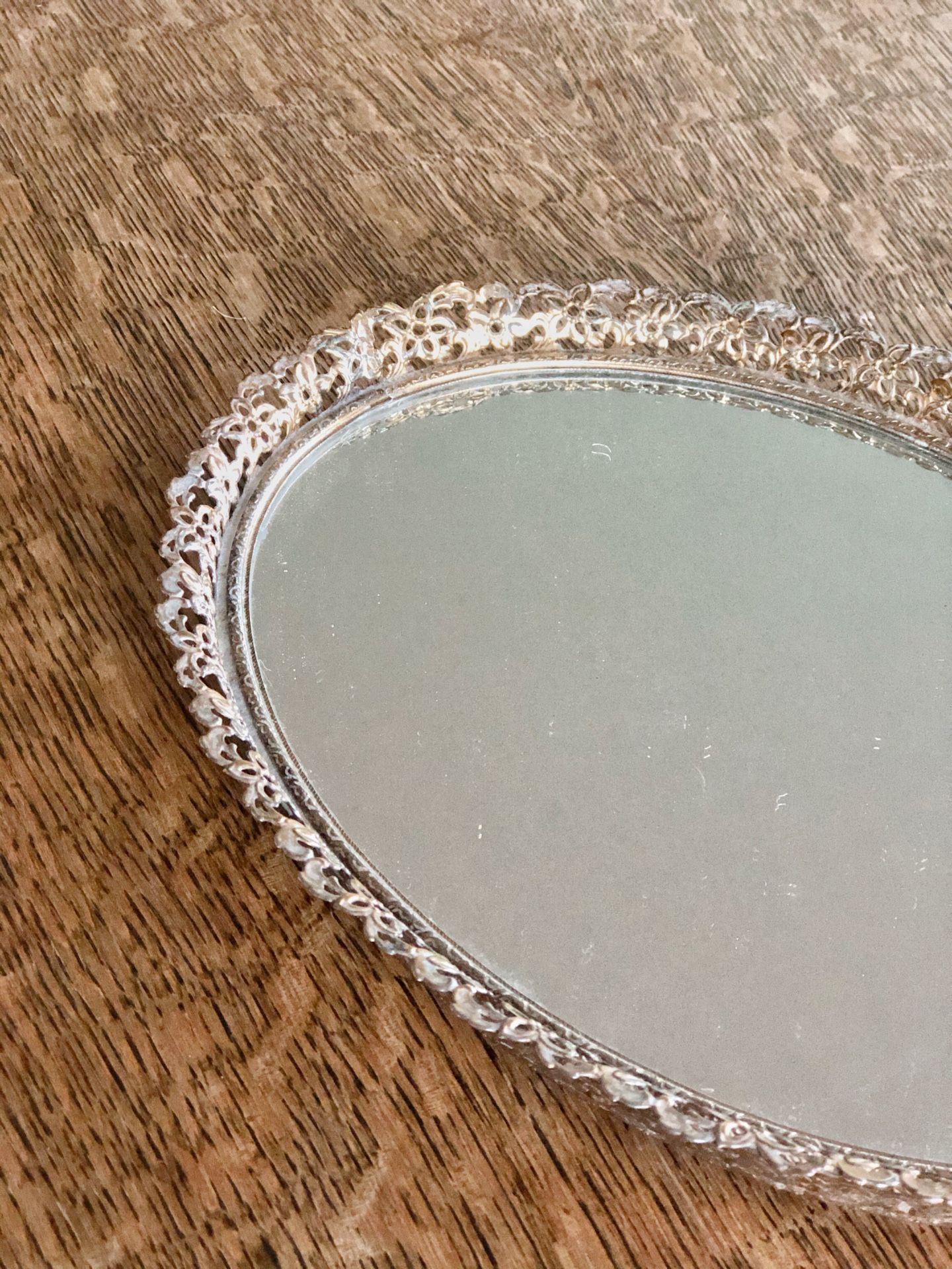 Beautiful vintage oval mirror tray / small hook on back for hanging if desired / small chip in glass by frame