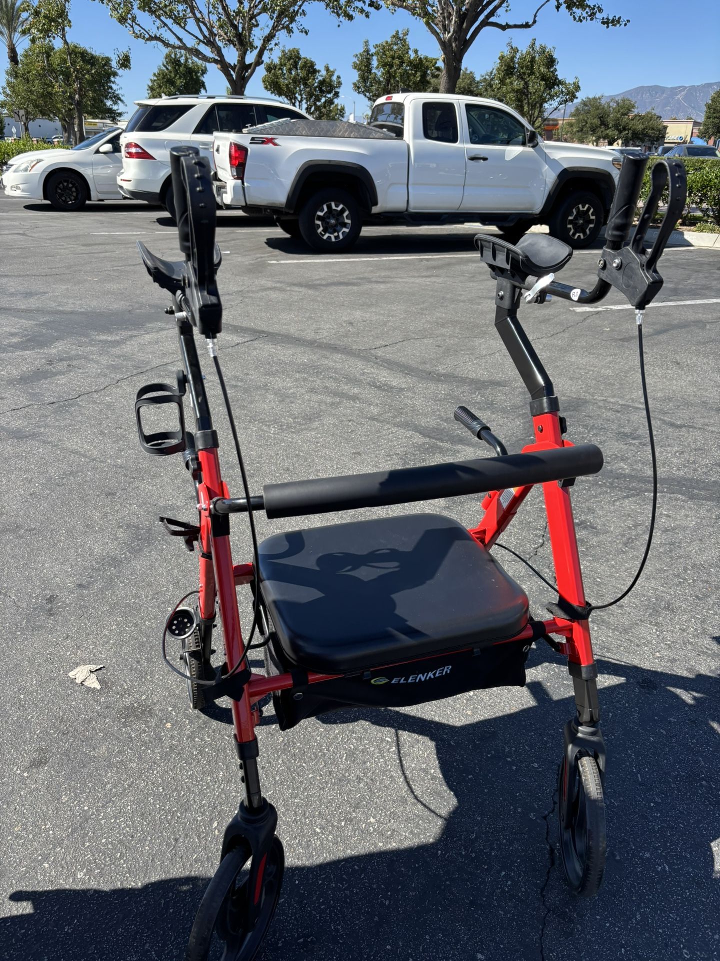Adult walker with armrest