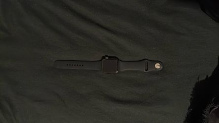 Apple Watch and Samsung ear buds, black