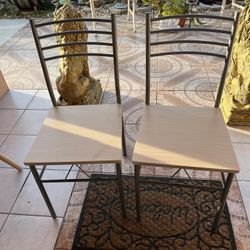 Two wooden and aluminum chairs in good condition and very clean