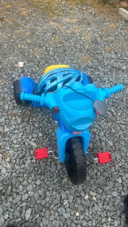 Kids fisher price ride on tricycle and helmet