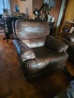 Brown Leather Oversized Armchair and sofa.