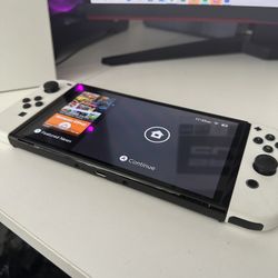 Nintendo Switch – OLED Model w/ White Joy-Con