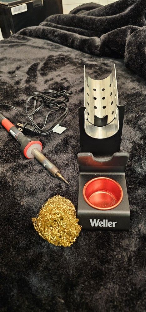 A Weller Hand soldering tool.