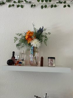 Two white hanging shelves