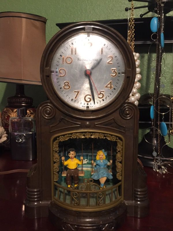 Antique vintage MasterCrafters 1940s Clock with swinging children. Clock works but swingers do not. 7x4x11. 35.00. Main Street Buda.