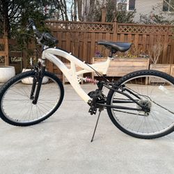 This is a white Next Plush MegaLight 26" 7005 Series mountain bike $79