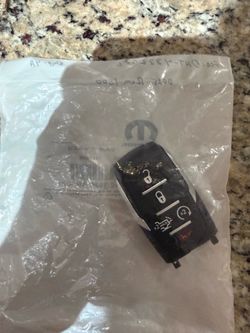 2025 RAM 1500 Smart Key 5 B OEM New  FCC# OHT-(contact info removed) - Silver Sides - (contact info removed)4AA