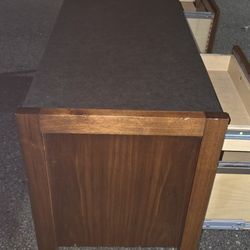 Wood Cradenza And Desk With Black Countertop