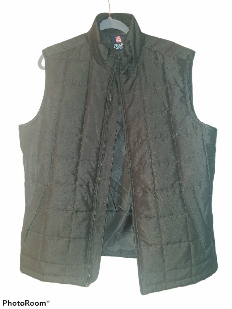 Nice! Tags gone, but never worn! Size medium. Puffer type vest.New men's medium vest. Super nice