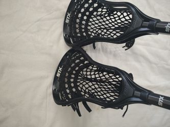 2 Lacrosse Sticks And Stallion Heads 