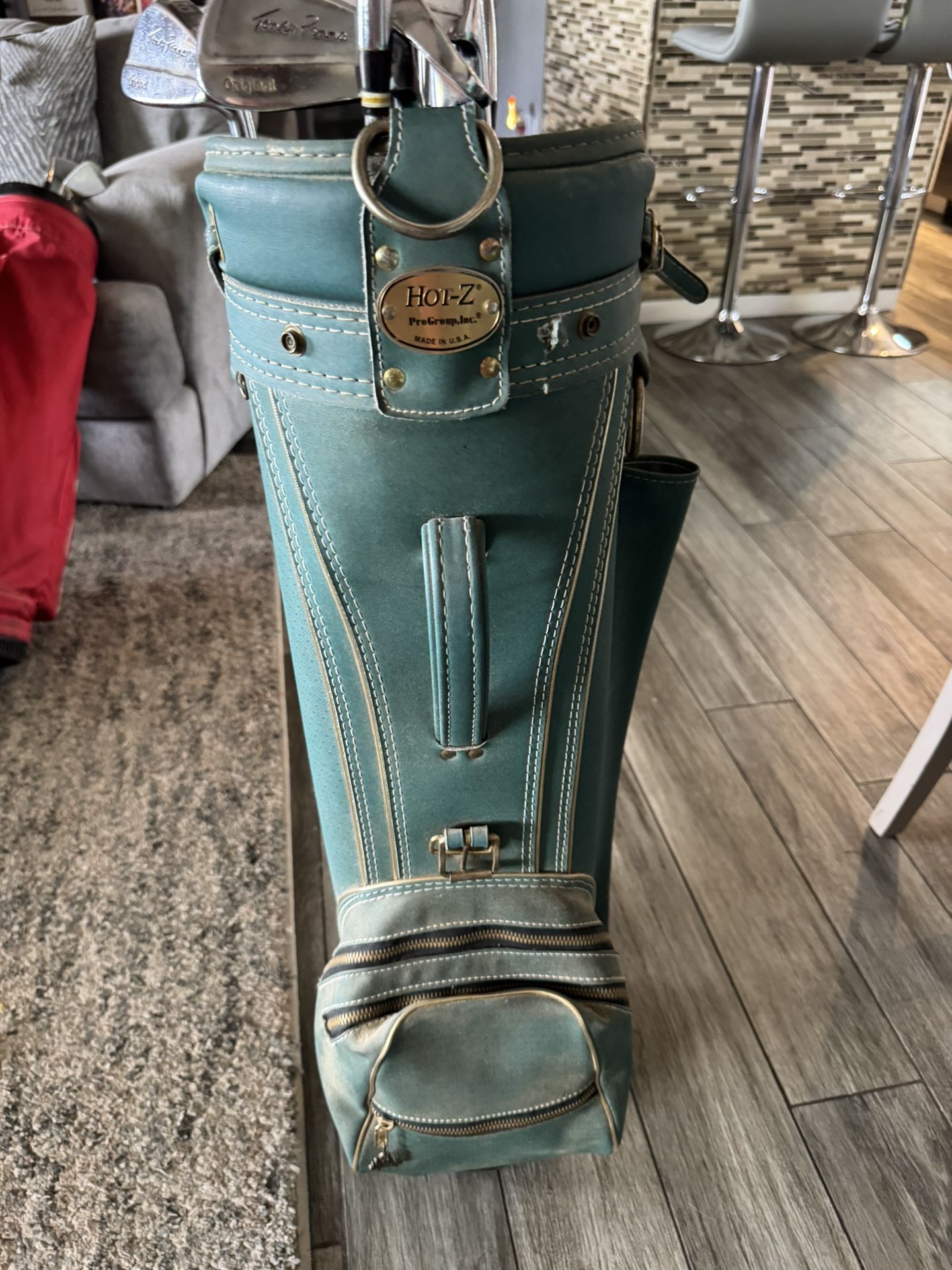 Toney Penna golf clubs with golf bag