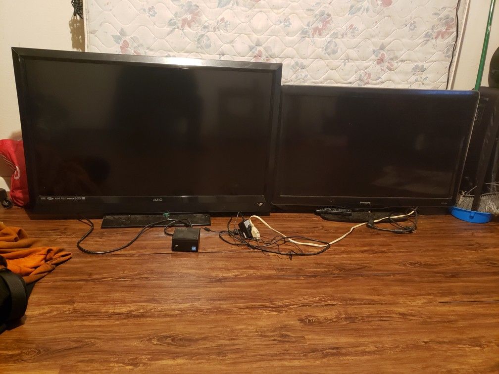 Two HD Flat Screen TV With Remote And a Gigabyte Mini Tower With Keyboard