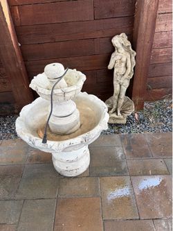 Bird bath fountain and lady