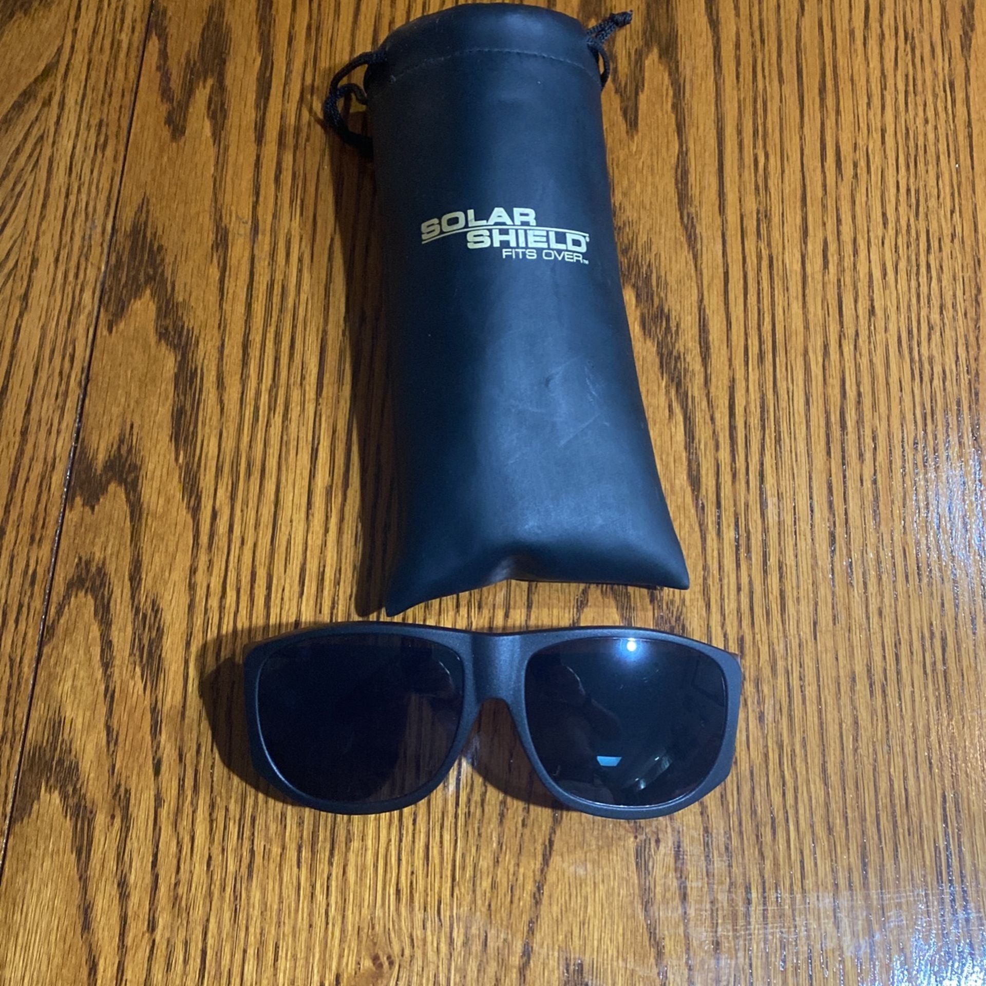 Solar Shield Sunglasses fits over any glasses $10